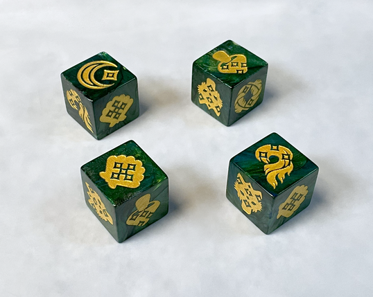 Four six-sided dice are a swirly forest green color with hints of shimmering black and blue. Each side of the dice are engraved with gold star shaped pips and symbols: A moon and star (1), feathers (2), a flame (3), a mushroom (4), a clam shell (5), and a wolf face (6).