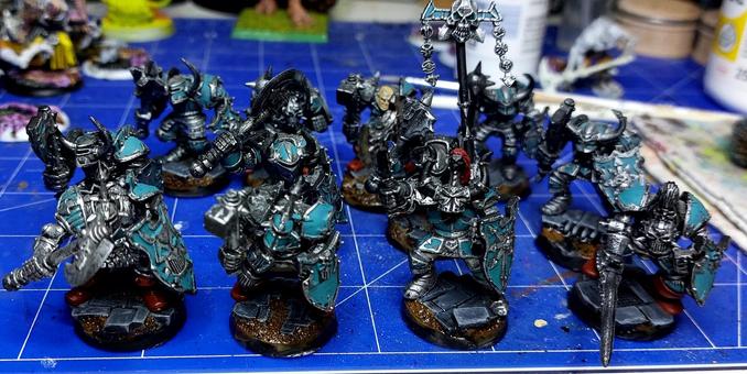 Chaos warriors being painted in desaturated turquoise
