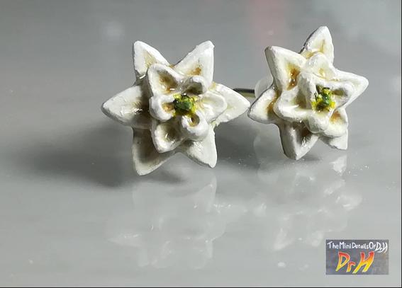 Earrings based on the first, ancestral flower. Face-on view.