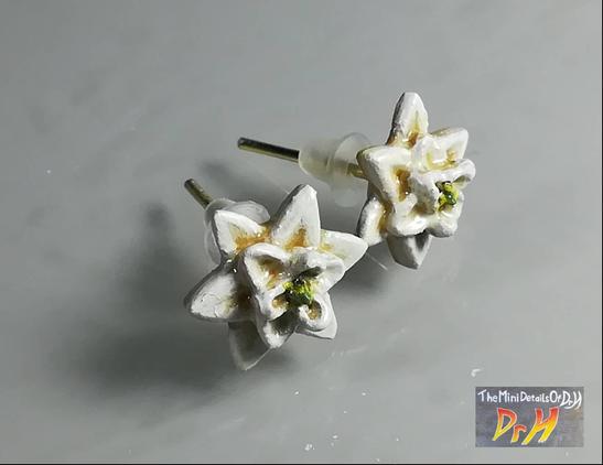 Earrings based on the first, ancestral flower. View from above.