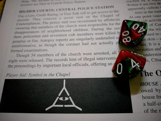 Close up of a page of "The Haunting" in the Call of Cthulhu rulebook with the symbol of the Chapel of Contemplation and two d10s turning up 40 and 4.