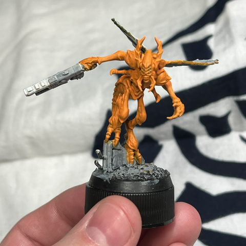 Vespid warrior in progress with bright orange base coat on its exoskeleton
