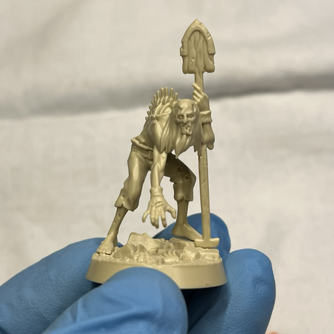 Unpainted and unprimed model of Toyle, a zombie from Zondara's Gravebreakers 