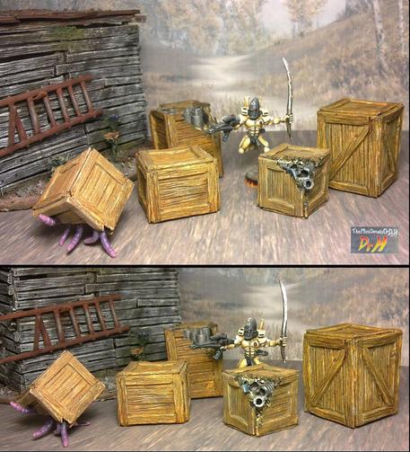 Example boxes arranged in a scene with an Eldar miniature chasing a box that is crawling with tentacles.
