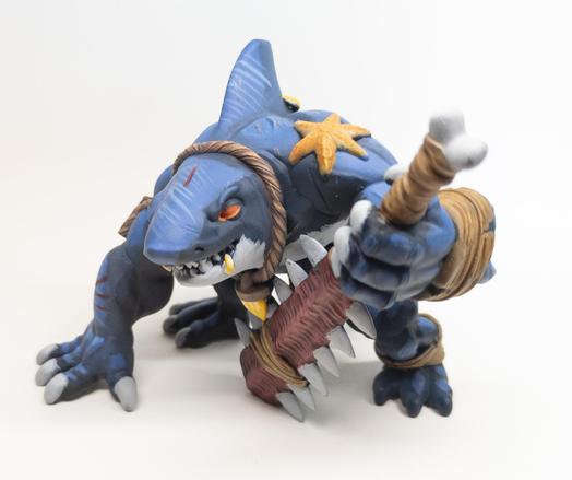 Crouching humanoid shark warrior with tooth greatsword, left side