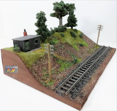 Model train display base, no train. corner view.