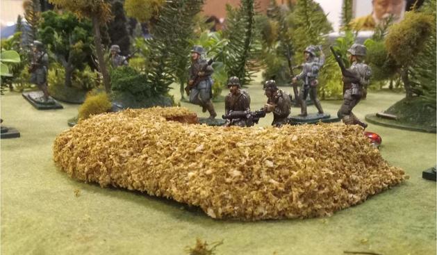Photo of a World War I German machinegun nest at Belleau Wood, as depicted in 54mm figures and wargaming scenery from a Skirmish Kids game simulating a small slice of the battle.