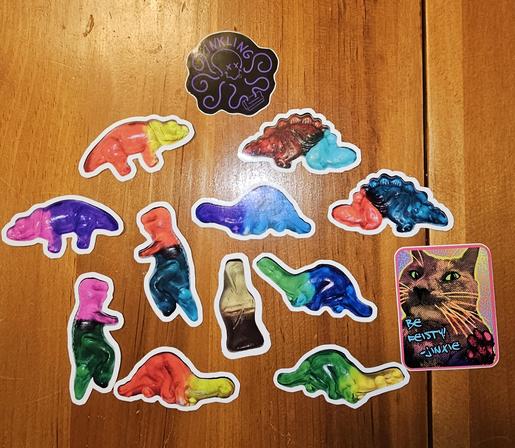A group of gummy dinosaur stickers on a table