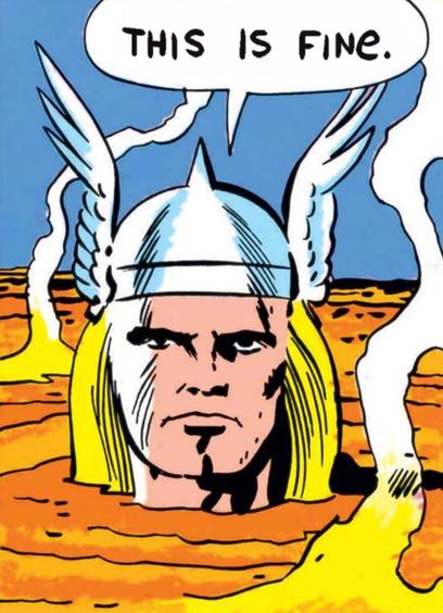 Marvel comics’ Thor is submerged up to his neck in lava. A speech bubble contains the words, “this is fine.”