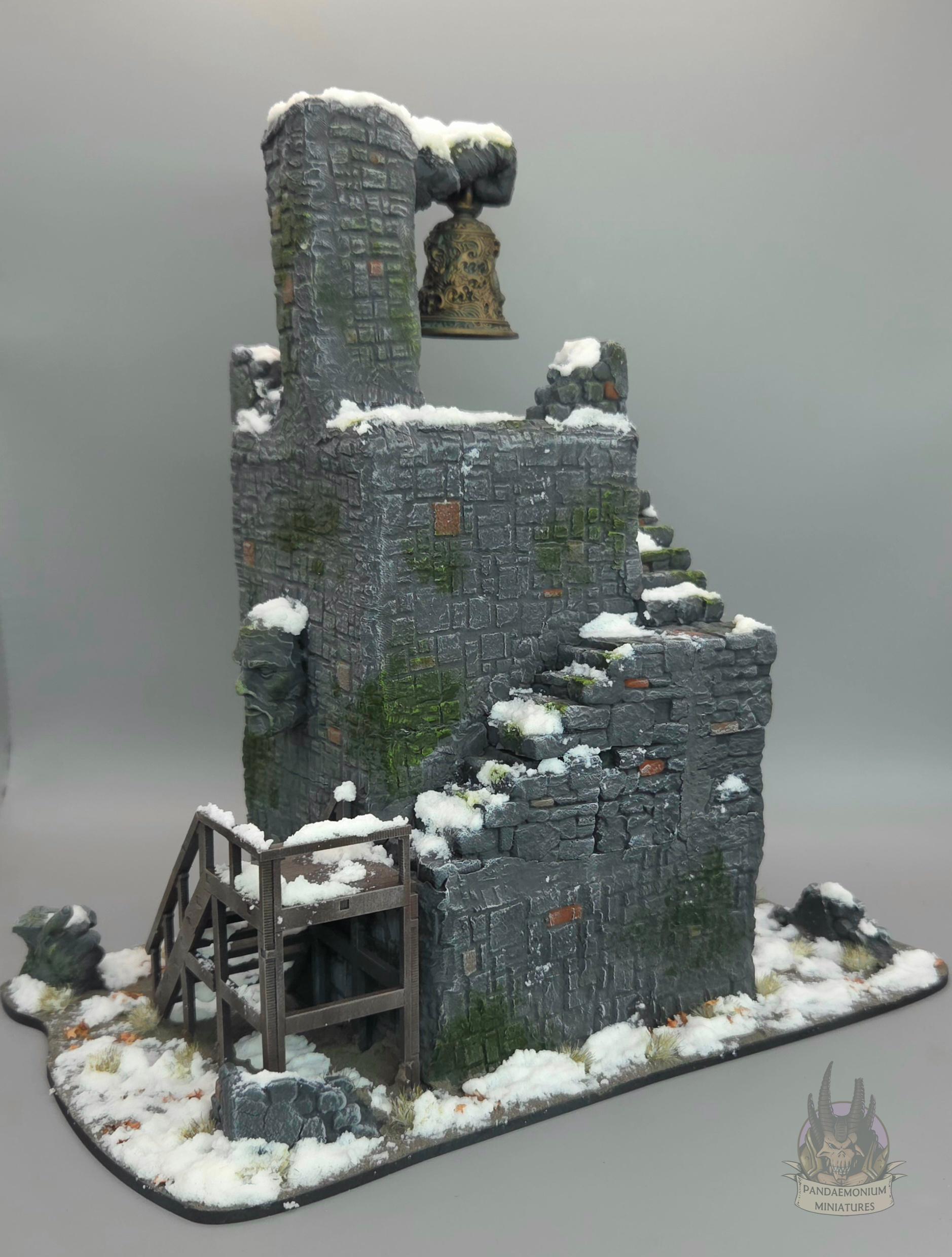 Stone belltower in a snowy setting with carved hand and face projecting from the walls. The first set of stairs is wooden, and the rest are stone, snaking up the outside of the tower. The bell itself is sculpted with a dragon design and clutched in a stone fist. A stone hand points ominously towards the stairs.