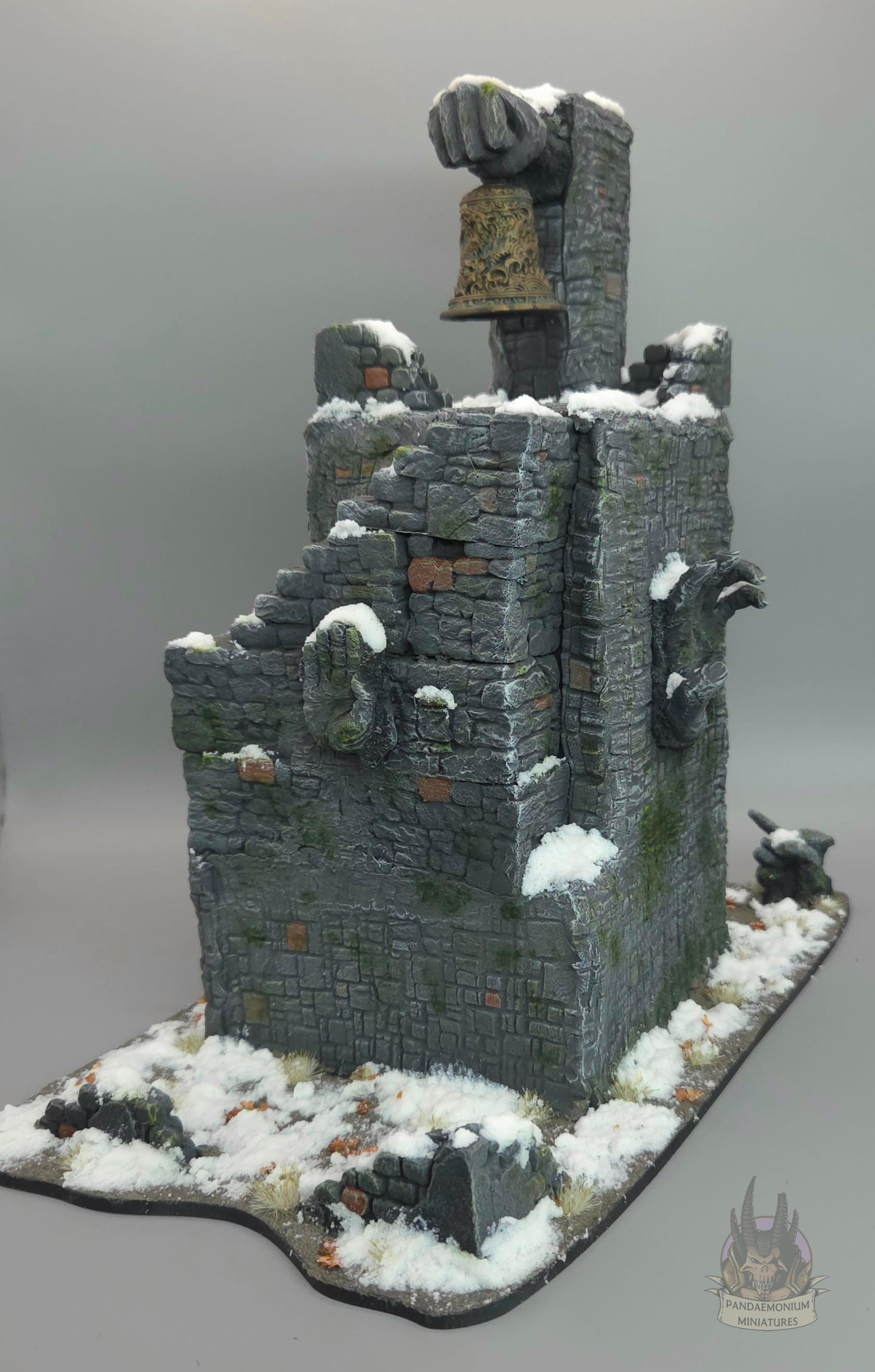 Stone belltower in a snowy setting with carved hand and face projecting from the walls. The first set of stairs is wooden, and the rest are stone, snaking up the outside of the tower. The bell itself is sculpted with a dragon design and clutched in a stone fist. A stone hand points ominously towards the stairs.