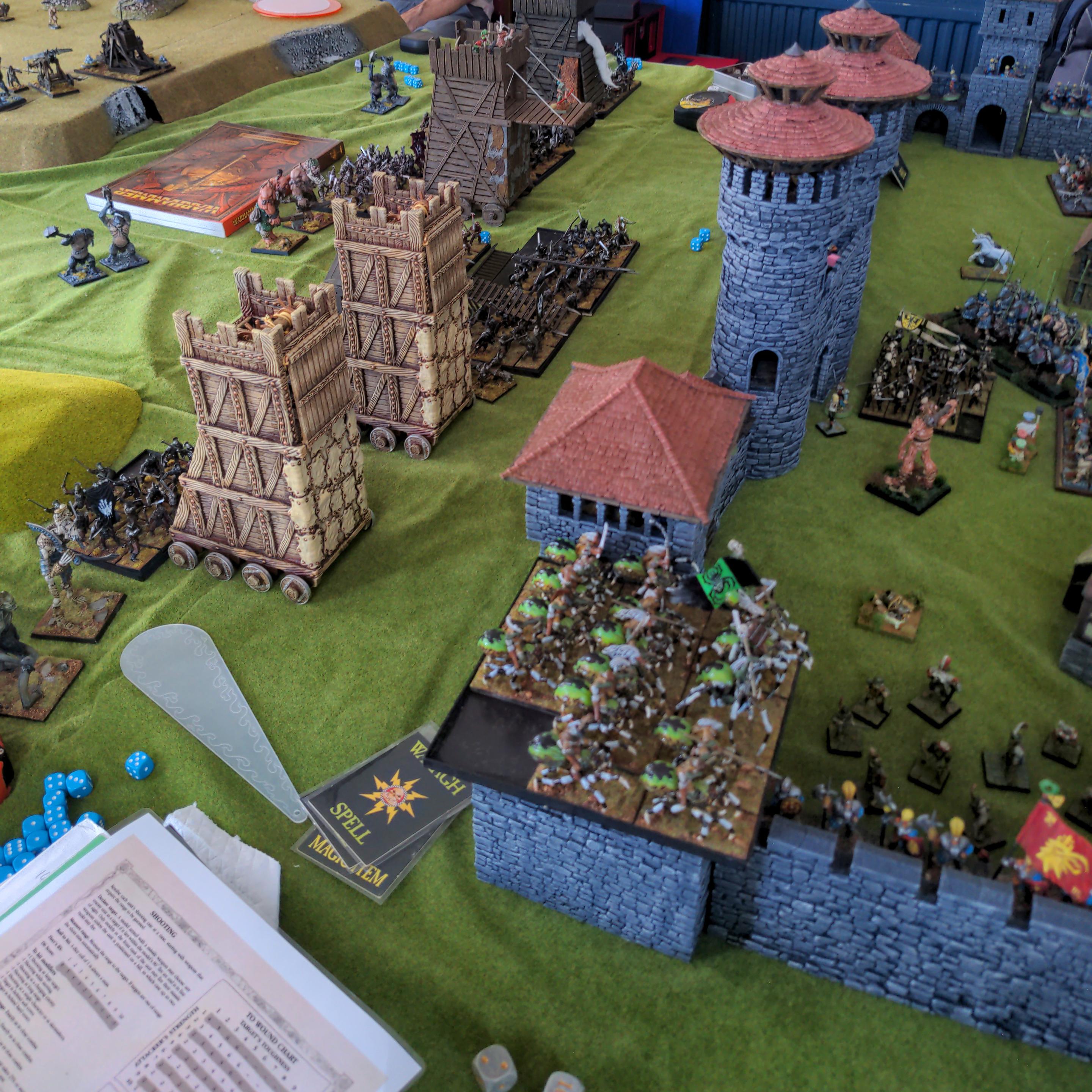The siege towers rumble towards the outer defences as the goblin spider riders swarm the wall creating panic amongst the defenders.
