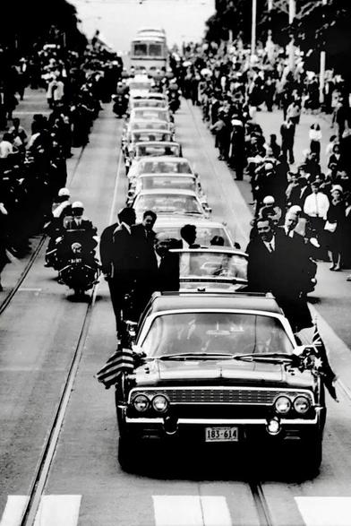 “Last night as he swept out of Melbourne two hours behind schedule he promised he would return, probably at the end of the war in Vietnam.
The Presidential jetliner, Air Force 1, left Essendon at 10 p.m.”

LBJ in Melbourne 1966.