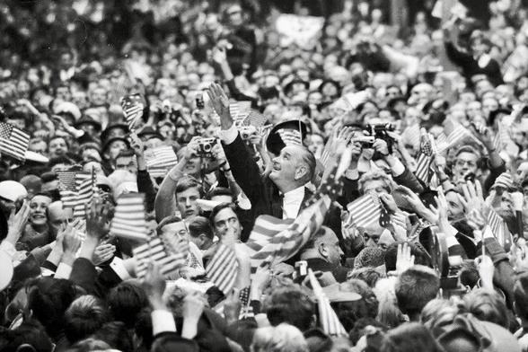 “Last night as he swept out of Melbourne two hours behind schedule he promised he would return, probably at the end of the war in Vietnam.
The Presidential jetliner, Air Force 1, left Essendon at 10 p.m.”

LBJ in Melbourne 1966.