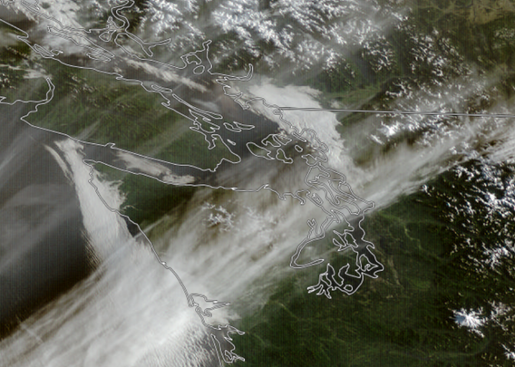 A satellite image of SW British Columbia and NW Washington showing low clouds from Surrey to Everett with high clouds along a line from Aberdeen to near Seattle to Omak.