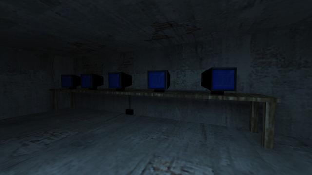 In this picture you can see the underground of the house. Actually the cellar, which merges into the Sewer. You can see an unlit room. On the wall is a very long wooden desk. There are five black CRT monitors on these. These show a blue background with white lettering on it. Under the desk, a small black box can be seen in the middle, where a cable leads up to the monitors. It's probably a socket. This is on the map cs_militia in the game Counter-Strike 1.6.
