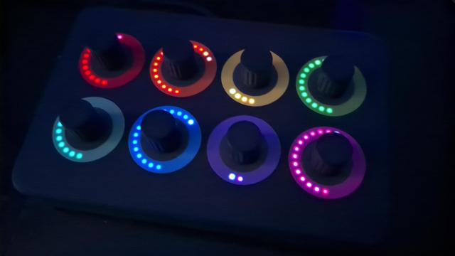 The Ottopot with the 8 custom stickers in darkness and showing different light positions.