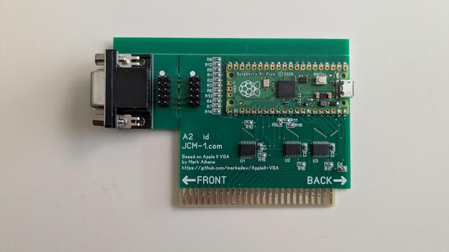 Green PCB of an Apple II expansion card. A VGA connector at top left, Pi Pico microcontroller at top right, small components near the bottom and an edge connector at the very bottom.

Text on the card: 
A2 Vidga
JCM-1.com

Based on Apple II VGA
By Mark Aikens
https://gitHub.com/markadev/AppleII-VGA