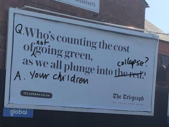 Billboard poster (Daily Telegraph) decrying supposed cost of 'going green' has been informally revised to indicate our children will pay if we don't do so