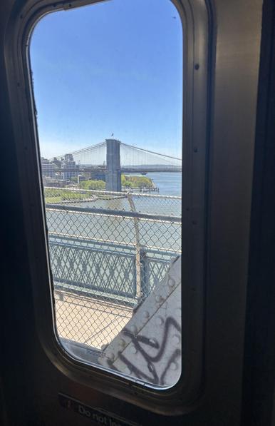 NYC Q train, crossing from Manhattan to Brooklyn, a view of another bridge, through a window on my subway.