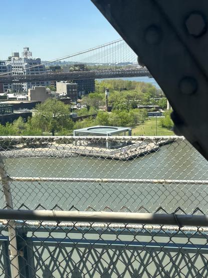 That carousel wrapped in glass, but it’s hard to see with the fence running through it from our bridge. On the Q train to Brooklyn.