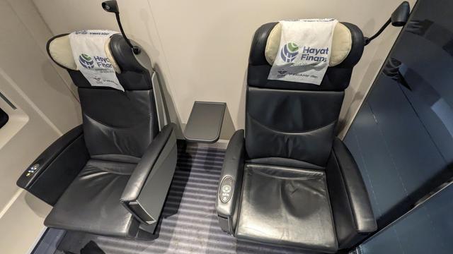 Comfortable seats in a 4 seat compartment of a YHT train.