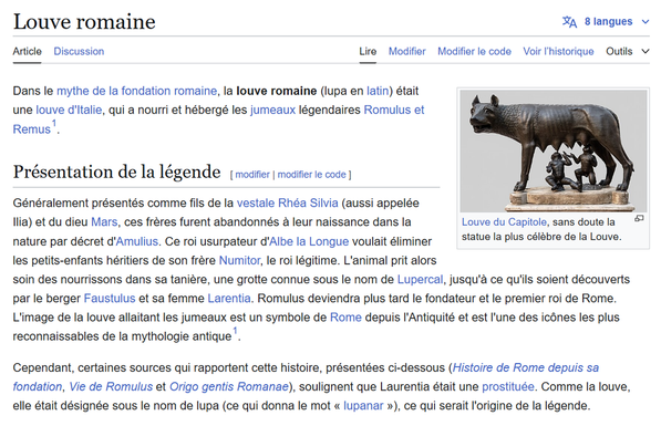 Capture d'écran de l'article Wikipédia sur la Louve romaine. Le titre de l'article apparaît en haut de la page, suivi d'un texte détaillant la légende de la louve qui a nourri et hébergé les jumeaux Romulus et Remus. À droite, une image de la célèbre statue de la Louve du Capitole montre l'animal allaitant les deux enfants. L'article explore l'origine mythologique de la louve et son rôle dans la fondation de Rome, ainsi que les personnages clés de la légende.