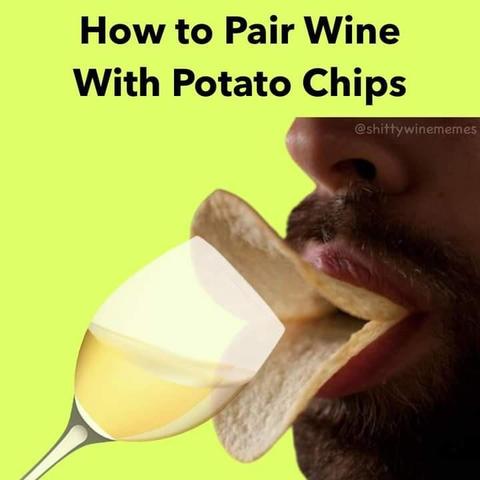 How to pair wine with potato chips
Pic of a man holding two chips like a beak with his lips, holding a glass of white wine to it