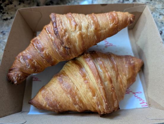 Two croissants in a box, I hope these croissants taste like doughnuts