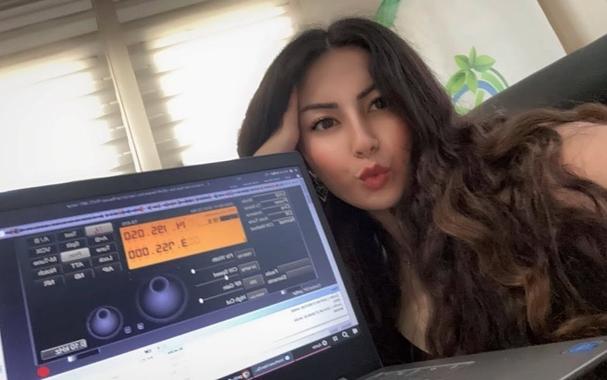 TA3TGC Tugce in front of her laptop runnig her station