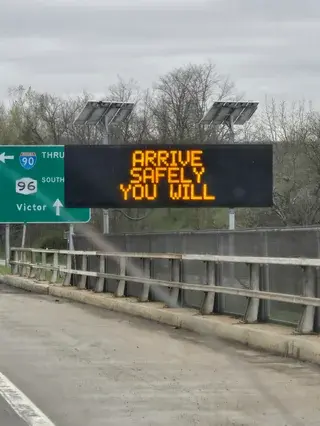 highway sign: arrive safely you will