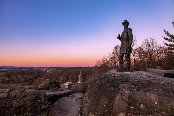 General Warren statue on Little Round Top in Gettysburg at sunset.