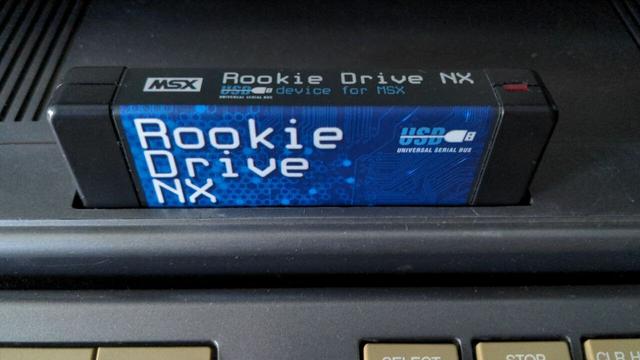 Closeup to a blue "Rookie Drive NX" cartridge.