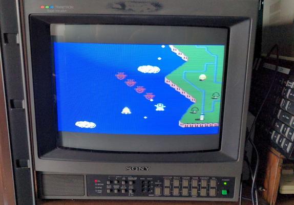 And a game on the Soy PVM TV: blue water, some green island nearby, a flying object and shooting spaceships (?) attacking.