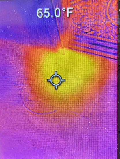 Bright orange glowing in a FLIR image of a shed floor
