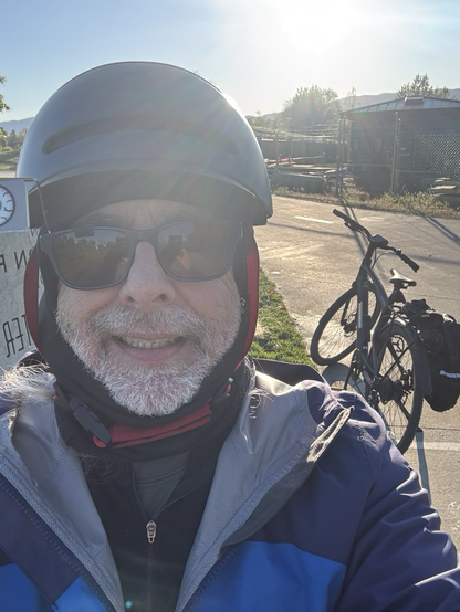 Selfie in front of the water park sign, my bike in the background.