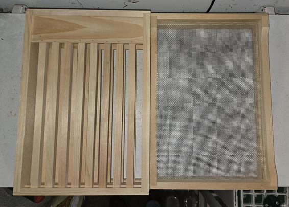Two unfinished slatted rack and vented inner covers for 8 frame beehives. The aid in helping the bees keep their hive ventilated.