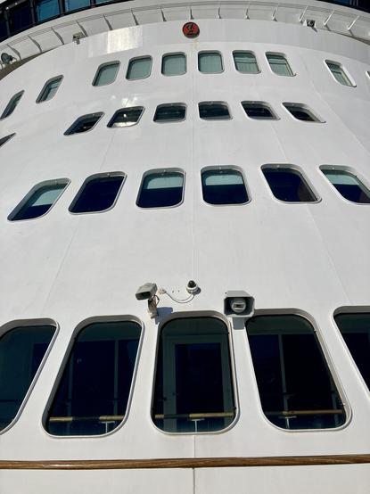 Many windows on the front of a cruise ship