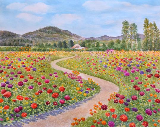 A winding pathway surrounded by fields of colorful flowers. Hills and trees in the distance.