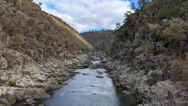 A river in a gorge disappearing to a focal point.