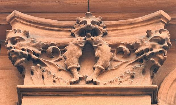 A column capital themed on the Zodiac sign of Gemini.