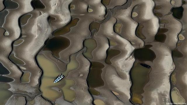 A drone view shows stranded boats over the sandbanks exposed due to drought at the Solimoes River, one of the largest tributaries of the Amazon River