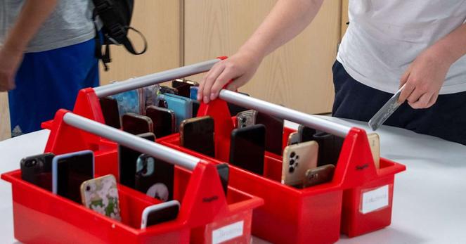 Crates for students to leave their phone. | Image: Mira Bäck / Yle