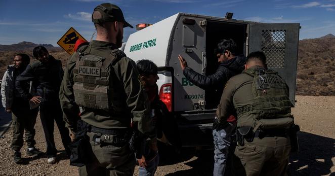 Border Patrol agents processing a group of migrants in Sasabe, Ariz., in February.