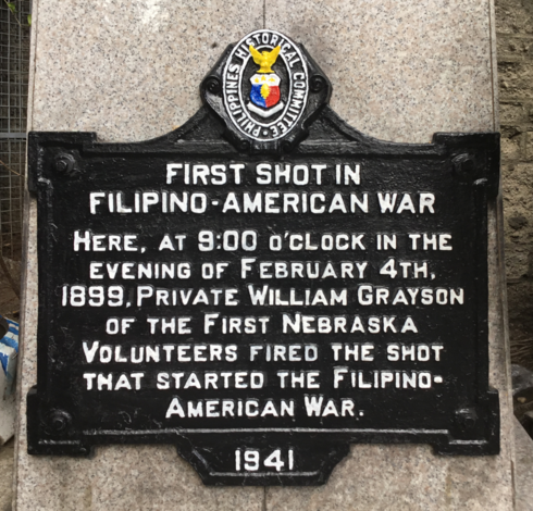 Photo of the historical marker created by the Philippines Historical Committee to commemorate the start of the Philippine–American War with the following inscription:

First Shot in Filipino–American War

Here, at 9:00 o’clock in the evening of February 4th, 1899, Private William Grayson of the First Nebraska Volunteers fired the shot that started the Filipino–American War.