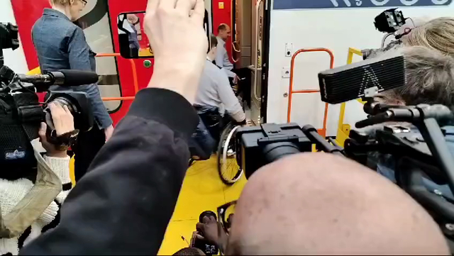 In the clip you see press recording the first person in a wheelchair to wheel themselves onto the train.
But the front wheels seem to get stuck and so someone steps in to help push them into the train.

Probably wouldn't have been a problem if the wheelchair user went a little faster, but yeah.