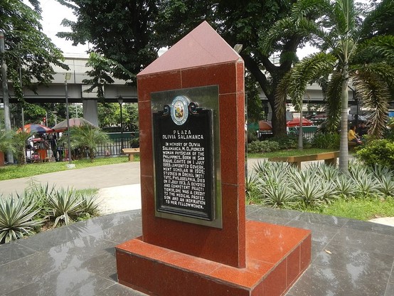 Small red-granite-clad obelisk bearing a historical marker with the following inscription:

Plaza Olivia Salamanca

In memory of Olivia Salamanca, M.D., pioneer woman physician of the Philippines. Born in San Roque, Cavite on 1 July 1889; appointed government scholar in 1905; studied in Drexel Institute, Philadelphia. Died on 11 July 1913. A devoted and competent practitioner, she was a credit to the medical profession and an inspiration to her fellow women.