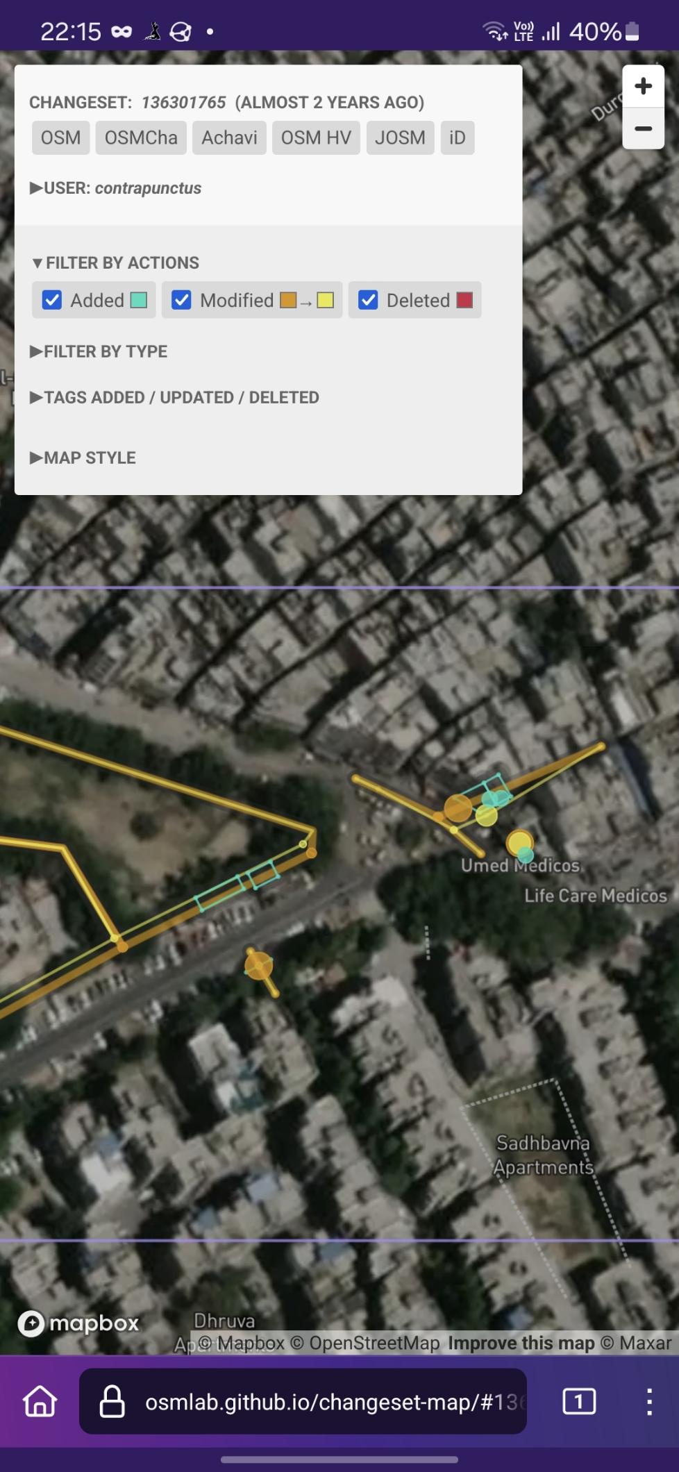 Screenshot of Changeset Map, visualizing the changes made. Among other changes, I've added two buildings to the left - the Aam Aadmi Mohalla Clinic and a dumpster - and two apartment buildings across the junction to the right. Screenshot of Changeset Map, visualizing the changes made. Among other changes, I've added two buildings to the left - the Aam Aadmi Mohalla Clinic and a dumpster - and two apartment buildings across the junction to the right.