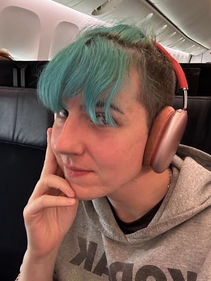 selfie, i'm sitting in an airplane, looking very tired