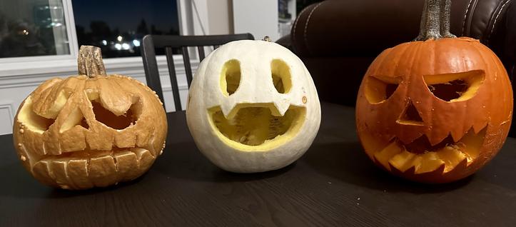 Brown, White, and Orange pumpkins I carved with the faces of Shin Megami Tensei’s Jack Bros (Jack the Ripper, Jack Frost, and Jack O’Lantern)